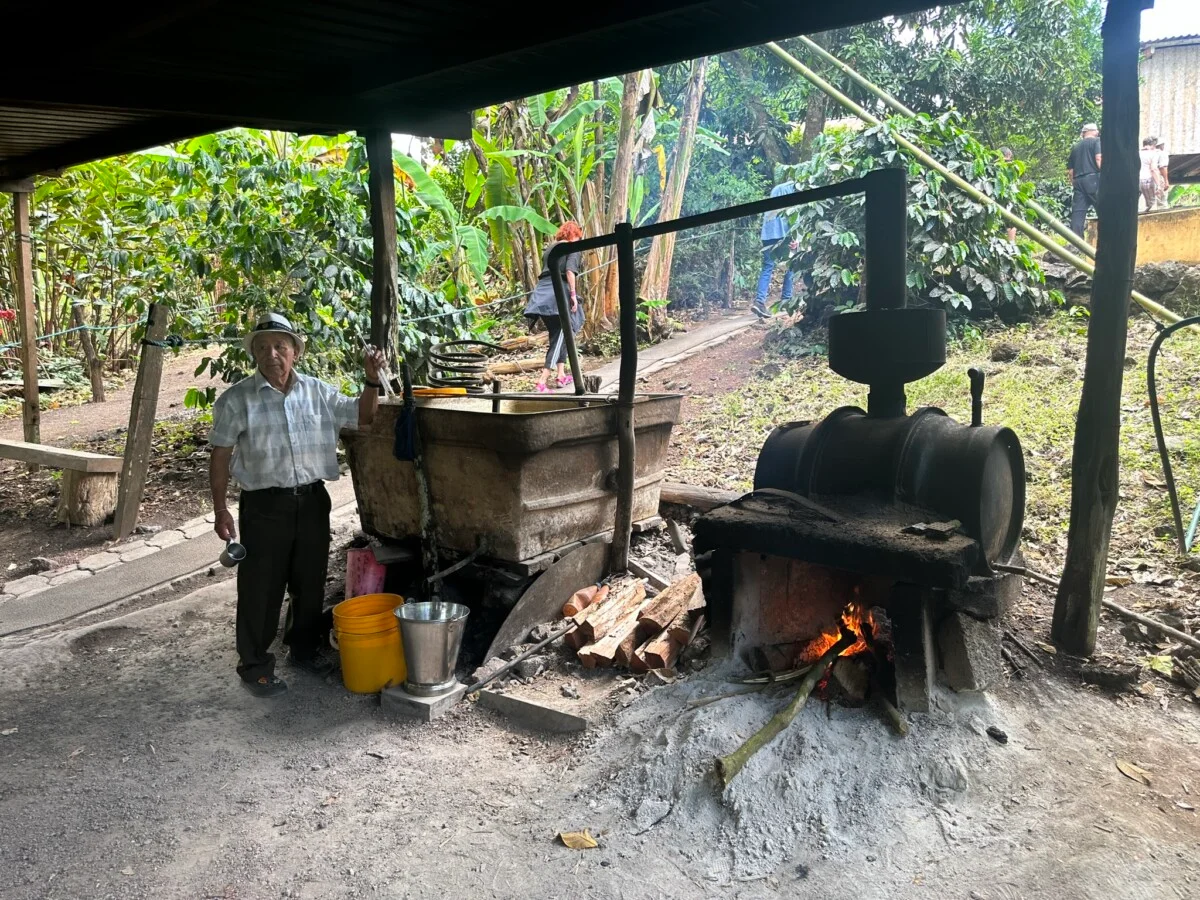 Farmer and moonshine maker Adriano Cabrera shows off his still.