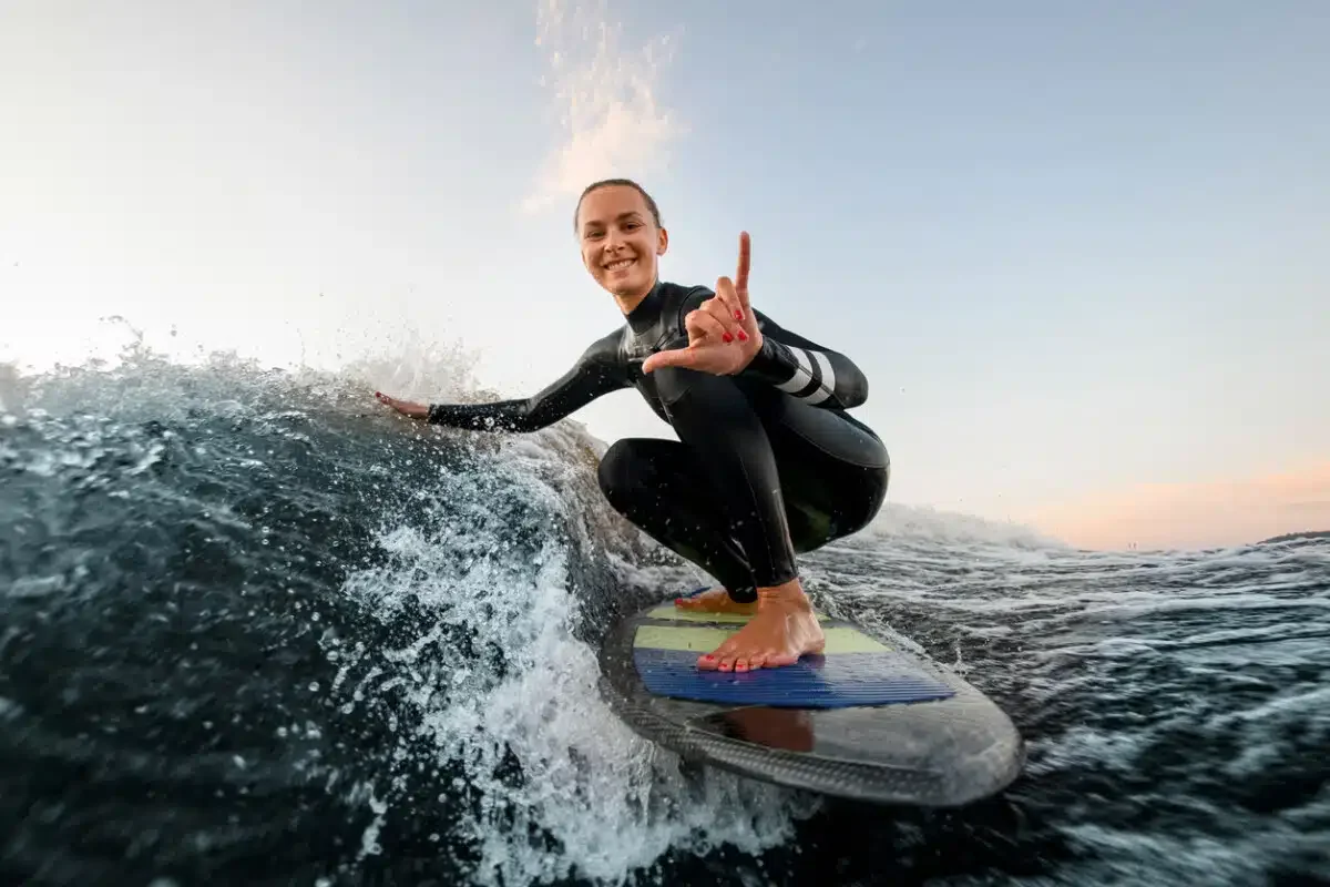 surfing woman in wet suit