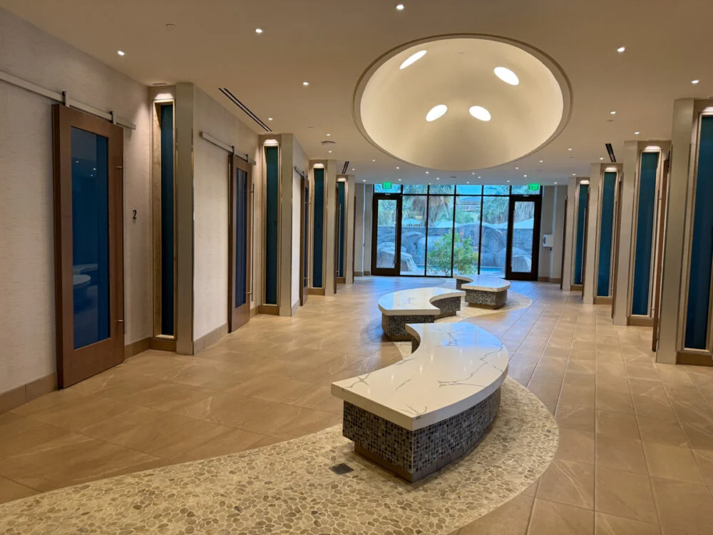 hallway with doors and natural opening at one end