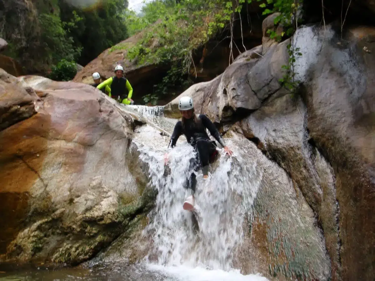 Going down the slide while canyoning in Lucca, Italy.