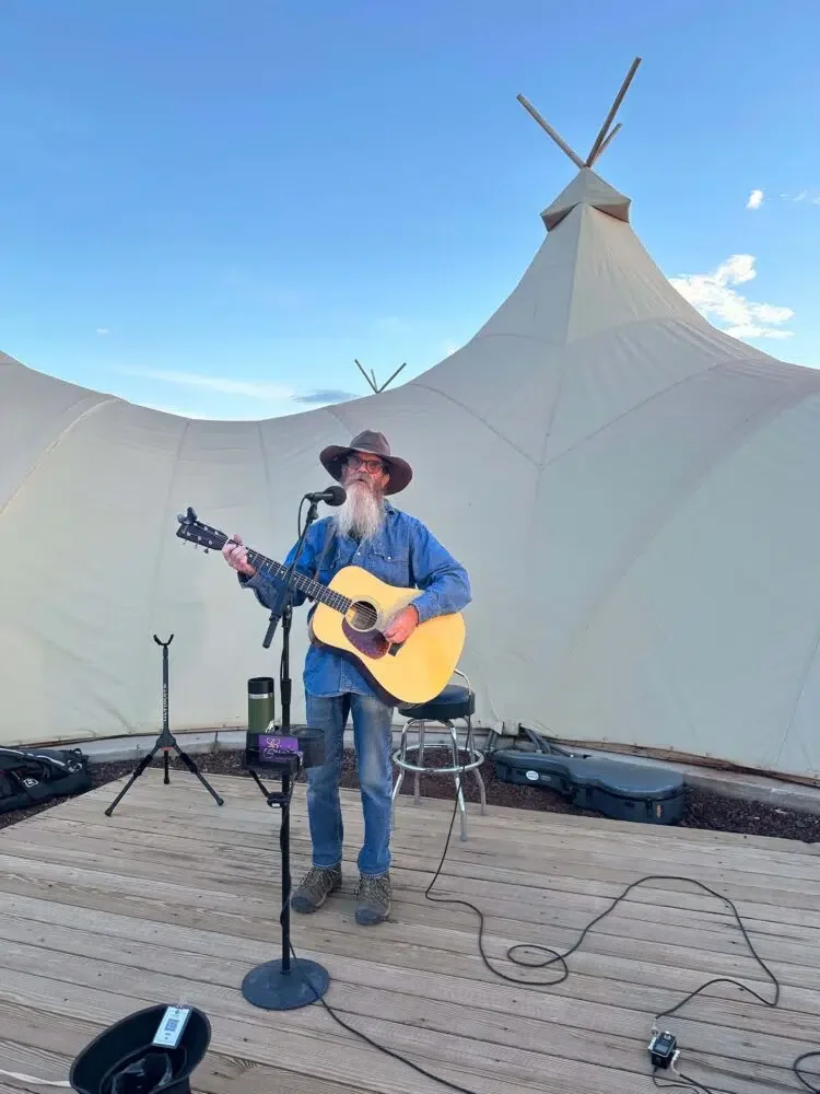 Entertainment at Under Canvas might include a singer/guitarist playing classic rock and blues. Credit: Geri Koeppel