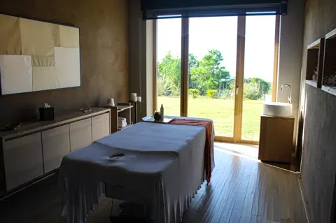 A massage room with a view at Adler Spa Resort Sicilia.