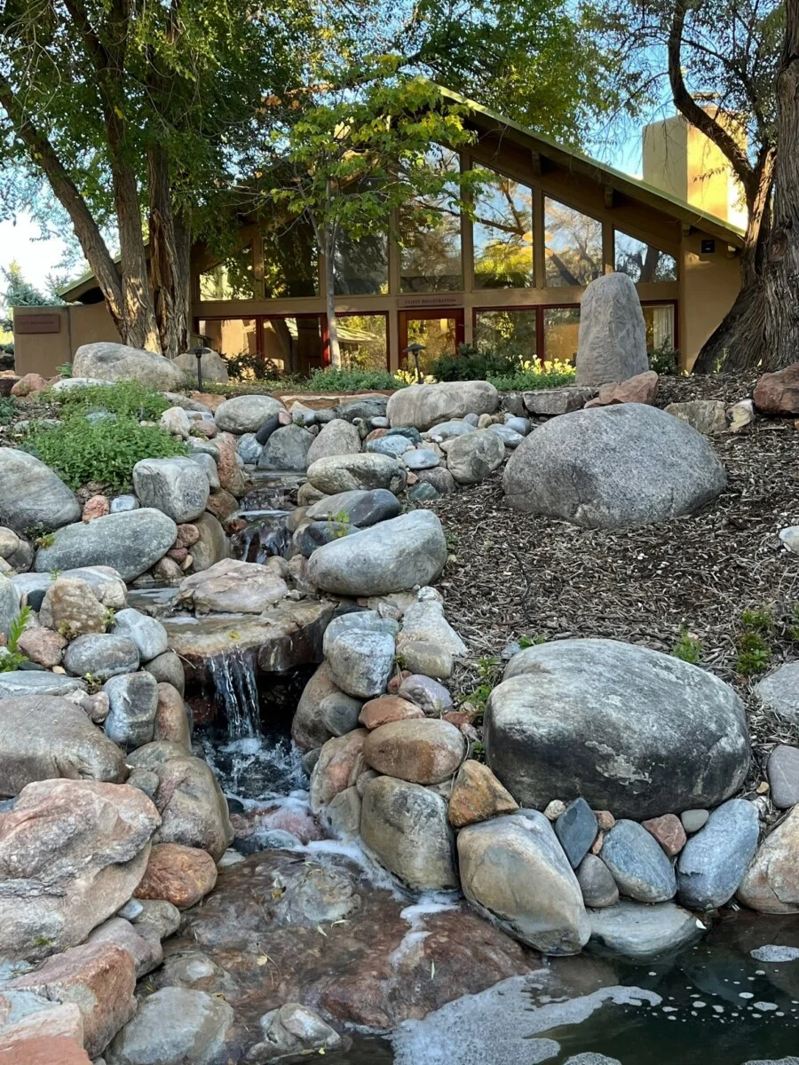 Relax near the waterfalls at Ojo Santa Fe, a Santa Fe wellness resort.