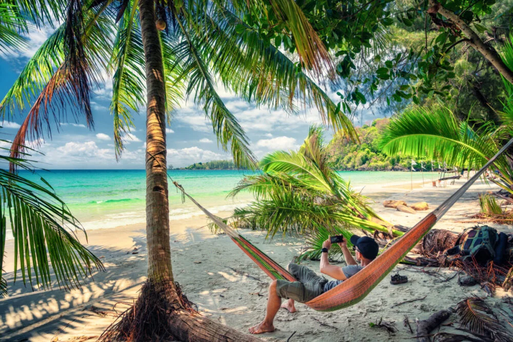 Travel people enjoy summer vacation on tropical beach with scenery coconut palm tree and crystal clear azure ocean water