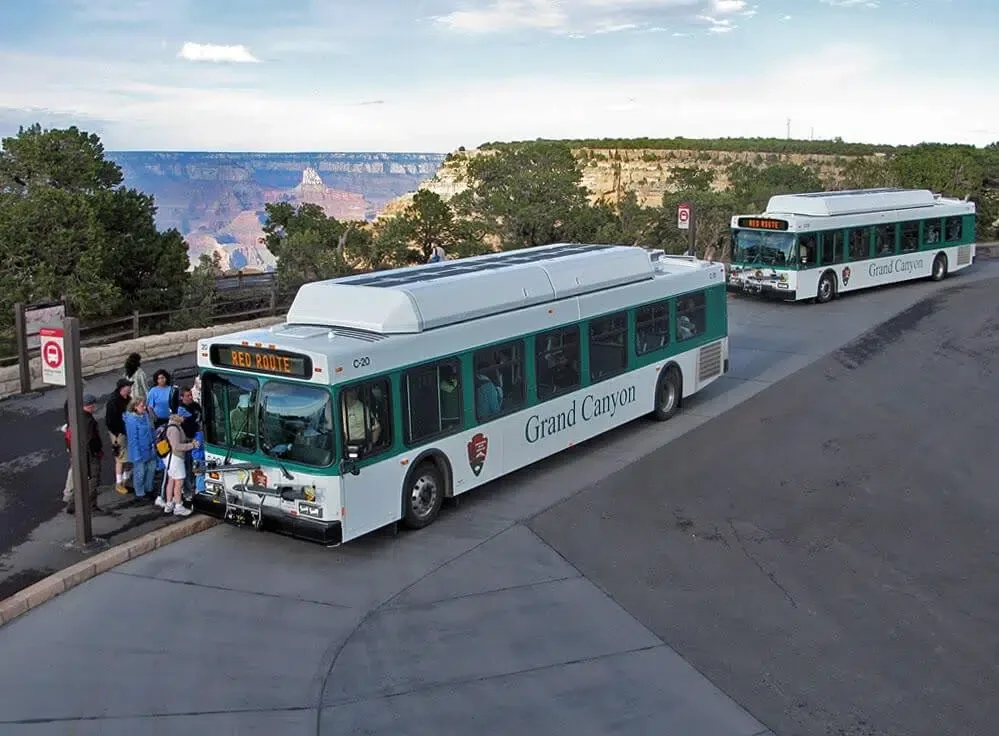 grand canyon shuttle bus with a crowd of people on the south rim